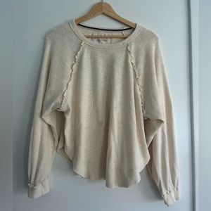 Cream colored sweat shirt